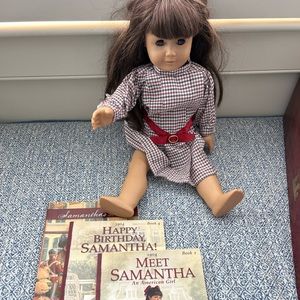 American girl doll Samantha with 3 books, 4 dresses, tights and a pair of shoes